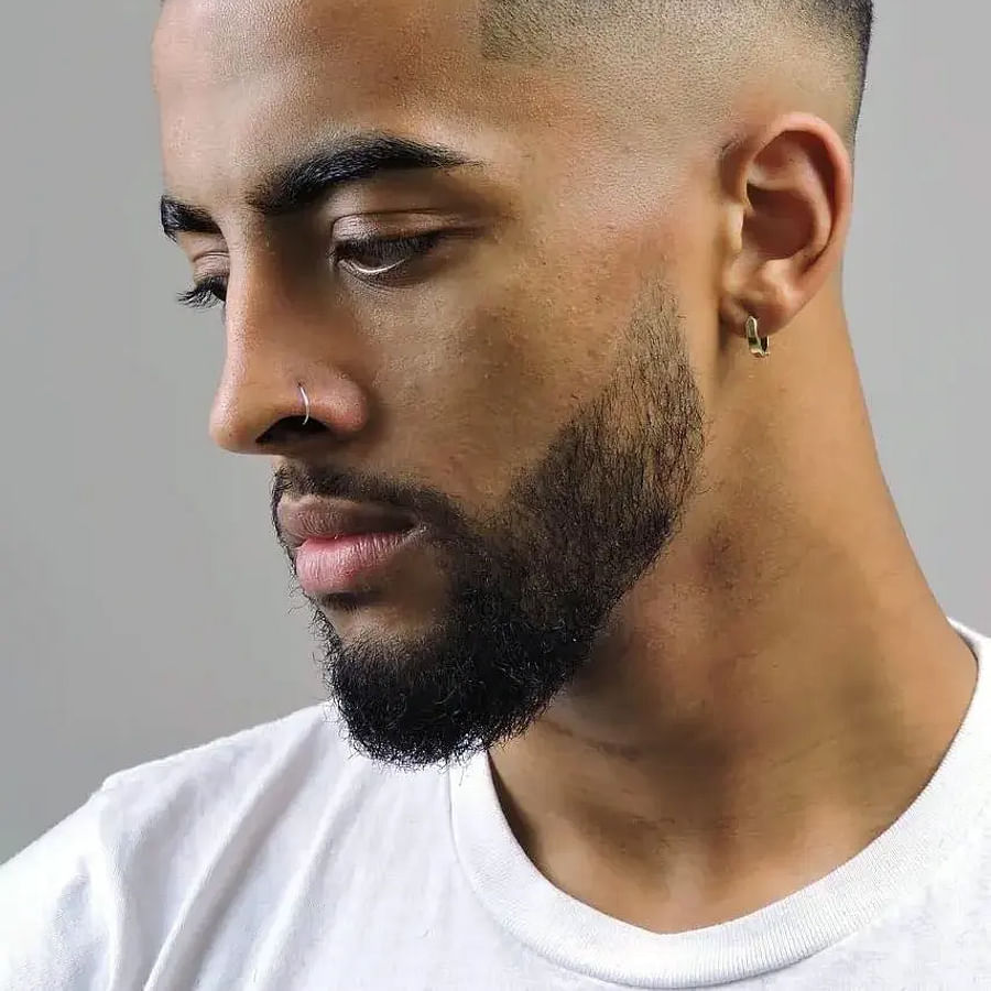 Series of men showcasing different styles of mid fade haircuts